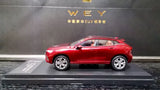Red 1:43 WEY VV7 diecast model car, side view
