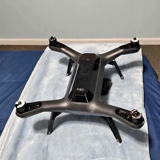 3DR drone body with quad rotors, dark gray frame and landing feet