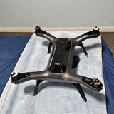 3DR drone body with quad rotors, dark gray frame and landing feet