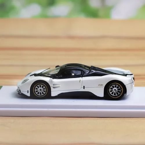 White 1/64 diecast sports car model with black roof, side profile on display base