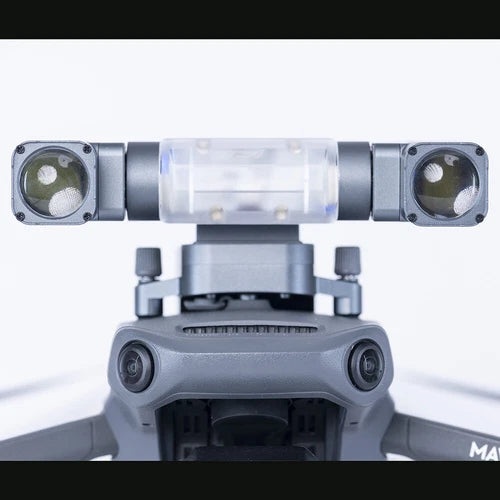 Gray gimbal searchlight module with dual round lens lights and clear central cover