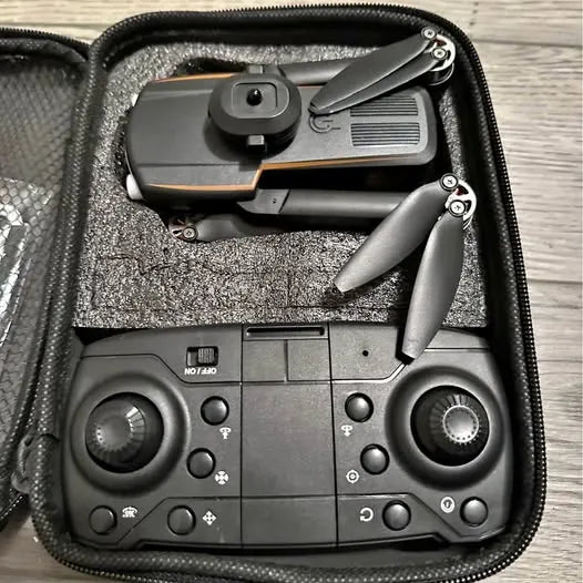 Gray drone controller with joysticks and buttons in zippered carrying case