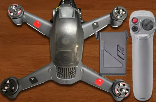 DJI FPV drone with motion controller and battery, gray drone body and front module