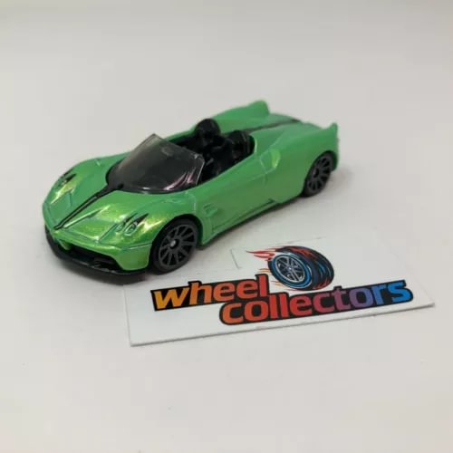 Green open-top roadster diecast model car with black front grille and wheels