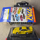 Yellow diecast sports car model in clear display case with box packaging