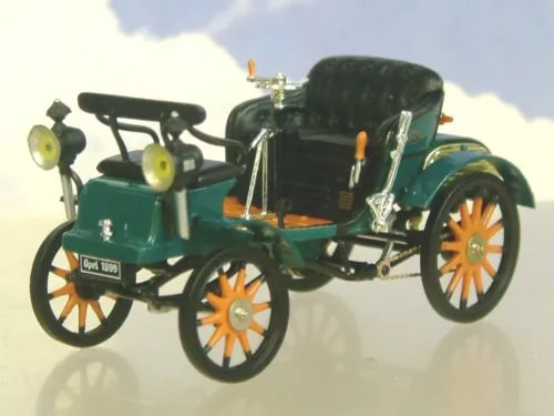 Green open-top vintage diecast model car with orange wheel accents and wheels