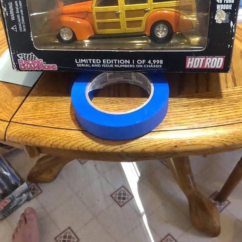 Collectible diecast car in box, orange with gold grille, Hot Rod branding
