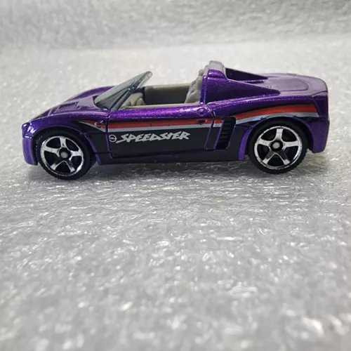 Purple and black diecast sports car model with side graphics