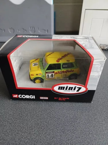 1:36 scale diecast racing car toy in retail box, yellow and green
