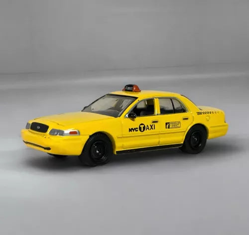 Diecast NYC taxi model car, yellow with black wheels and NYC OAXI lettering