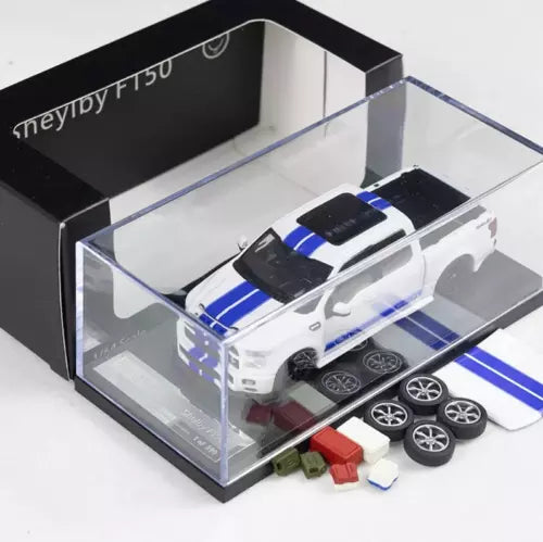White 1:64 diecast pickup truck model with blue racing stripes, in clear display box