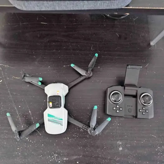 Reno NV drone with camera, white body; four propellers beside controller