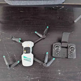 Reno NV drone with camera, white body; four propellers beside controller
