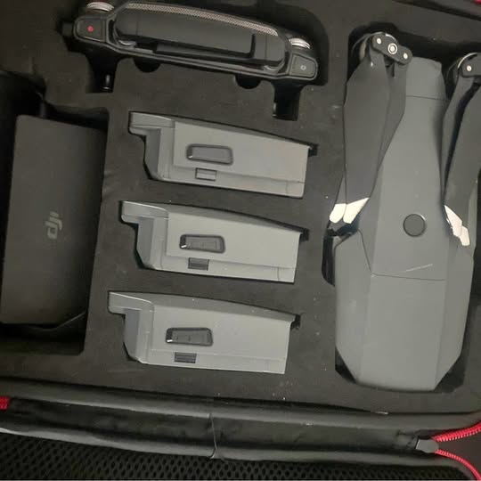 Drone accessory case with three gray battery modules
