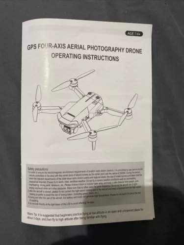 Drone operating instructions sheet with printed diagram of a GPS FOUR-A quadcopter