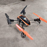 Blade 180 QX quadcopter drone in orange and black with front camera and four propellers