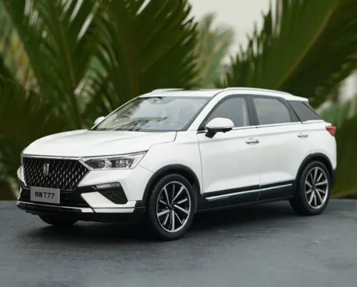 White diecast model car in front three-quarter view, with black grille and alloy wheels