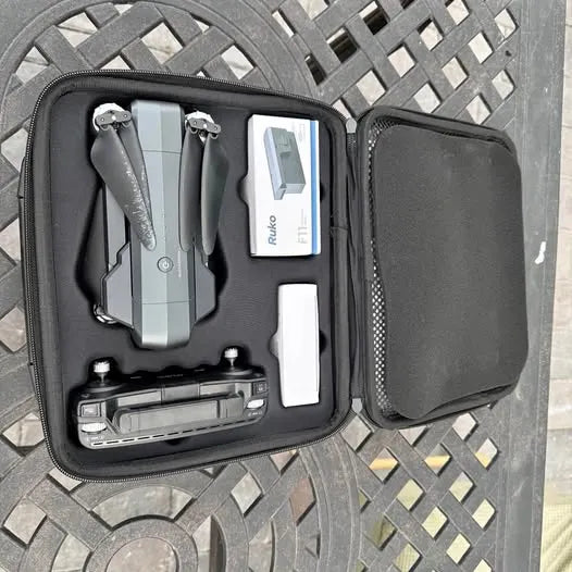 Ruko F11 drone hard case with compartments and mounted drone