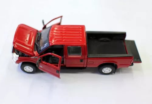 Red diecast pickup truck with open doors, showing interior detail.