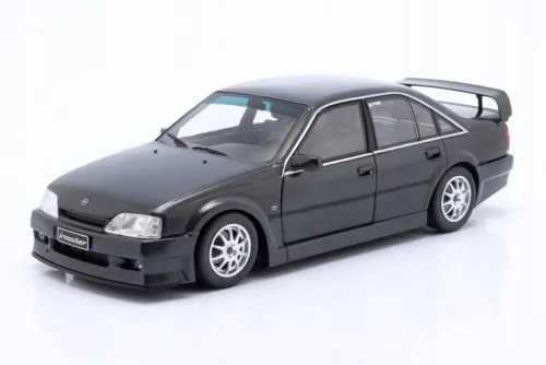 Dark gray 1:18 scale diecast sedan model car with front grille and headlights