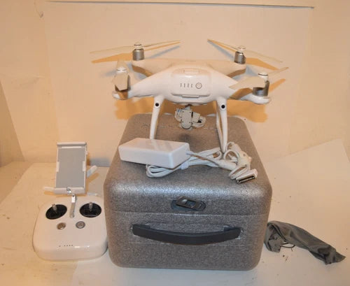 DJI Phantom 4 Pro drone with camera gimbal and remote controller, on case