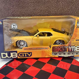 Two-tone yellow diecast car in clear display box with yellow accents