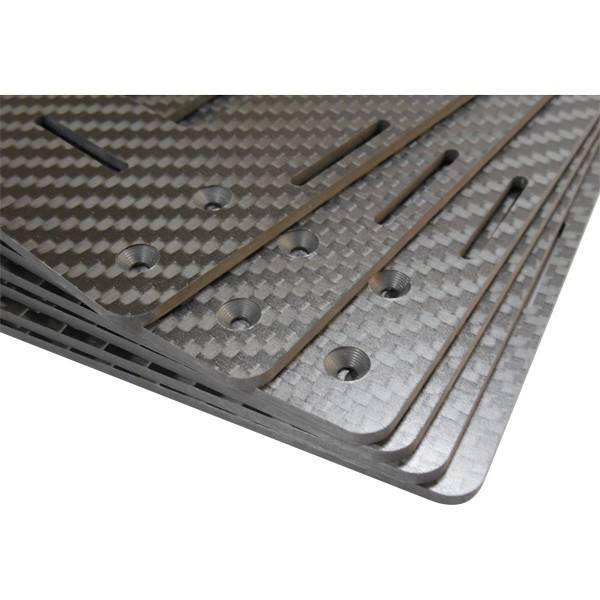 Carbon fiber plate panel with machined holes and slots, black-gray woven texture