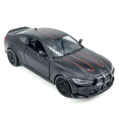 Matte black diecast model car with orange racing stripes, front three-quarter view.