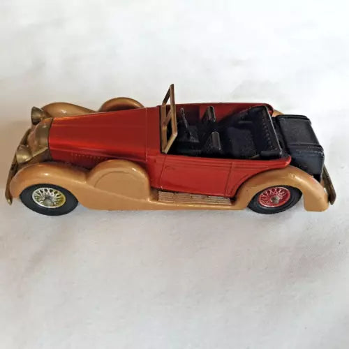 LESNEY Matchbox vintage diecast car, red body with cream fenders and black interior, side view