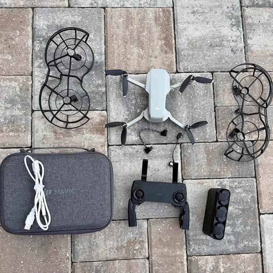 DJI Mini Mavic drone kit with controller, battery, spare parts and carrying case