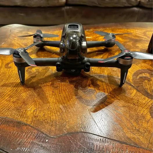 FPV drone with front camera and four propellers, gray body