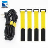 Yellow nylon self-adhesive hook-and-loop strap with black fastening ends