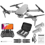 White 4K quadcopter drone with camera, remote controller, and carrying case with accessories