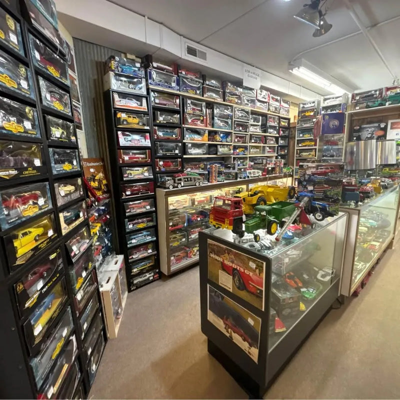 Diecast car display case with miniature cars in glass top
