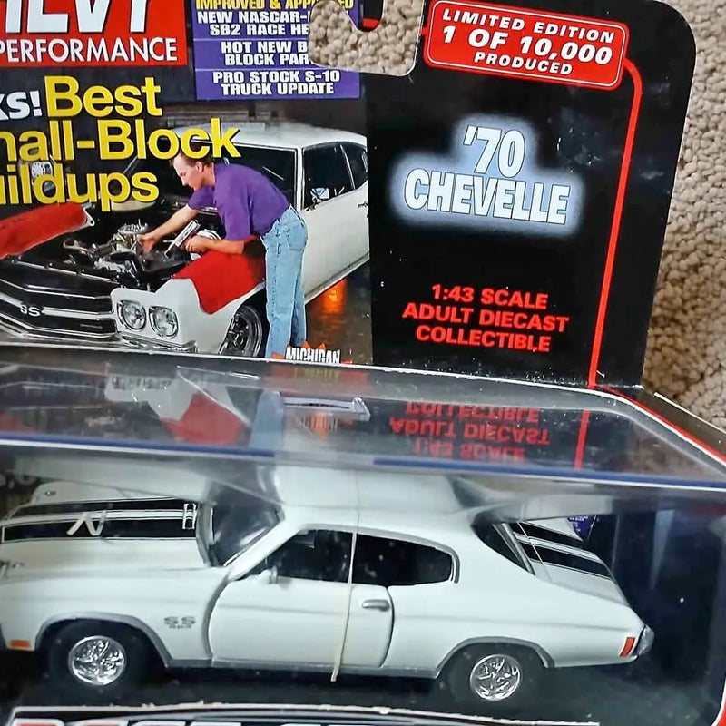 1:43 scale diecast car model, white with black stripe and red tail lights