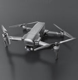 Foldable gray quadcopter drone with 4 propellers and camera module