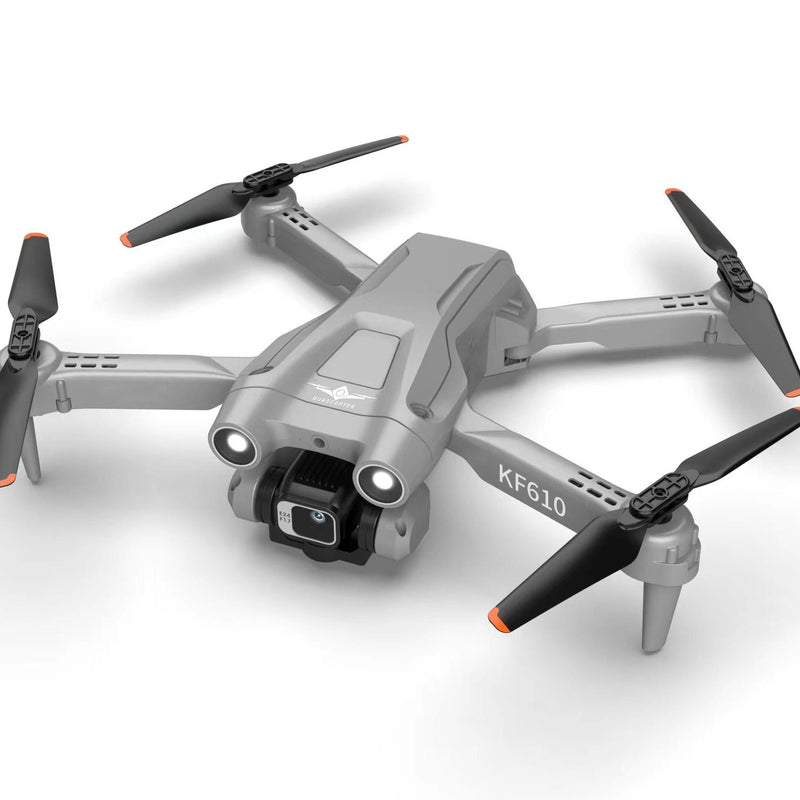Light gray RC quadcopter drone with front camera and four propellers