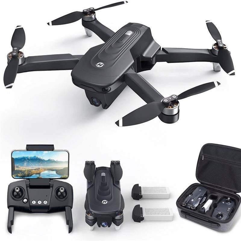 Black quadcopter drone with 4 propellers, foldable arms, controller and carry case