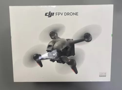 DJI FPV drone with propellers and camera module, on retail box.