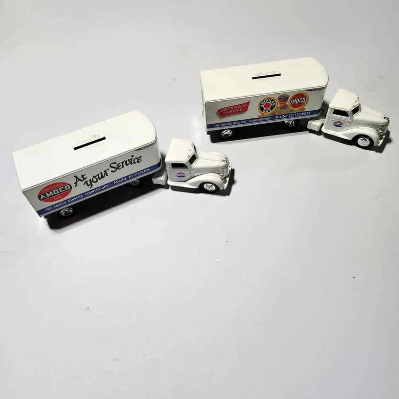 Diecast service truck bank, white with red/blue logos and open trailer cab, two-pack