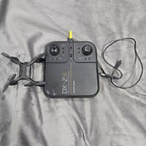 Stunt drone controller with antenna, charging cable, and propeller drone