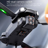 Black quadcopter drone with dual camera module and angled lens housing