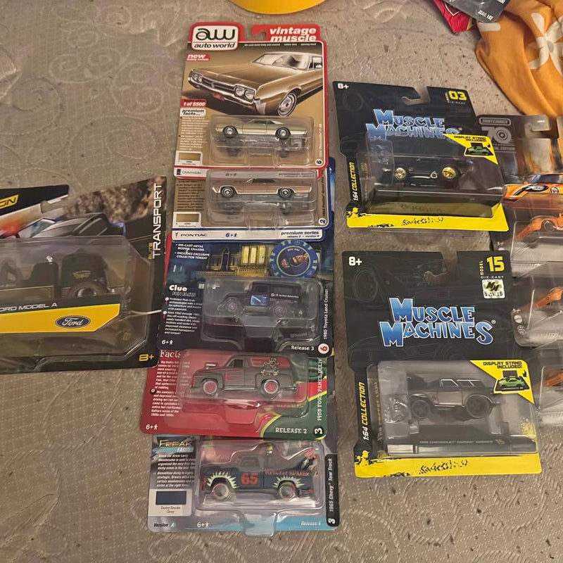 Diecast car lot set in retail packaging, multiple classic car model boxes
