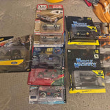 Diecast car lot set in retail packaging, multiple classic car model boxes