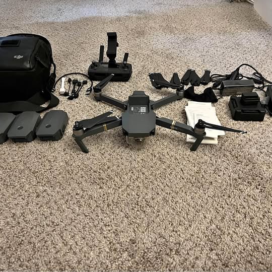 DJI Mavic Pro drone kit with controller, propellers, batteries, and carrying case