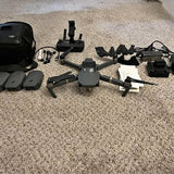 DJI Mavic Pro drone kit with controller, propellers, batteries, and carrying case