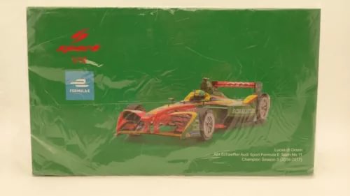 1:18 diecast formula race car in box, red and yellow with sponsor graphics