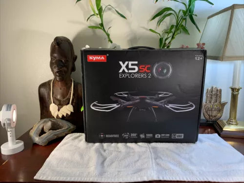 Syma X5 SC drone retail box with helicopter graphic, dark gray with red logo
