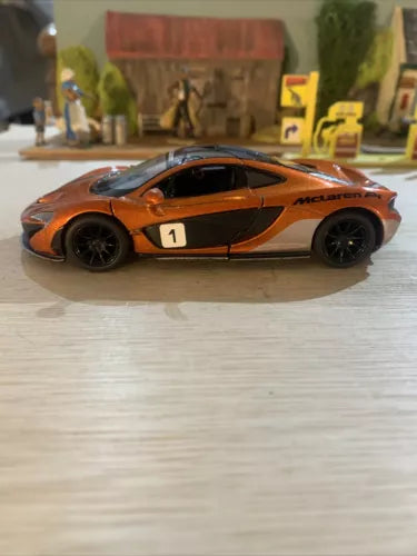 Burnt orange McLaren P1 1/36 diecast sports car with black side stripe, side view