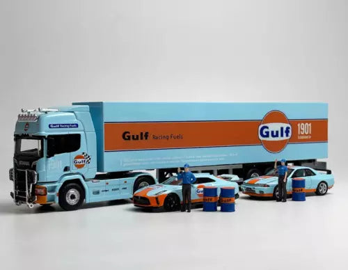 Gulf racing diecast metal vehicle set with light blue truck, two orange race cars, and crew figures